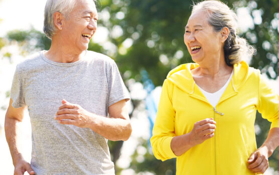 Photo of an elderly couple jogging