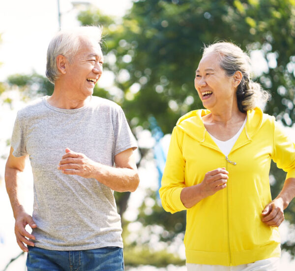 Photo of an elderly couple jogging