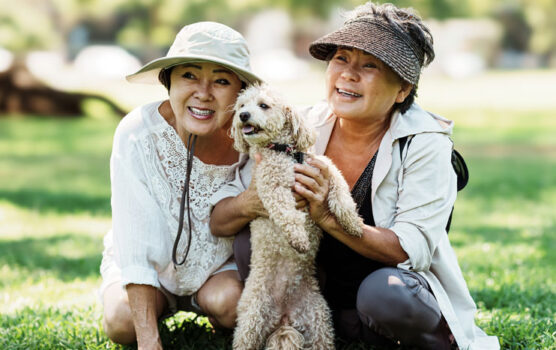 Photo of two ladies and their dog