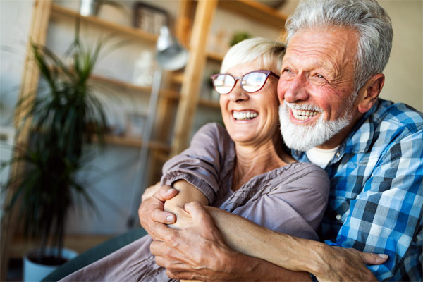 Image of a happy older couple embracing